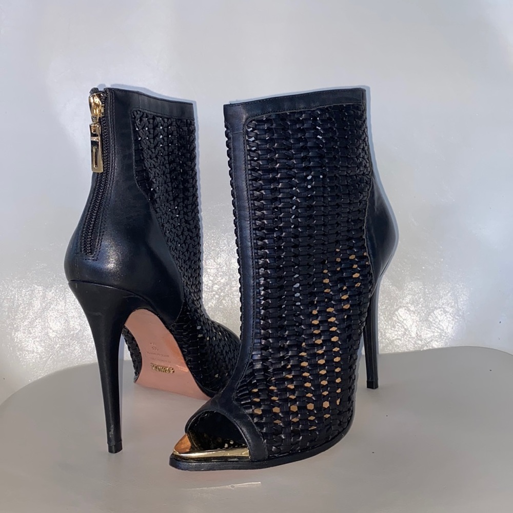 These are 3 year old black Schutz High Heel shoes.